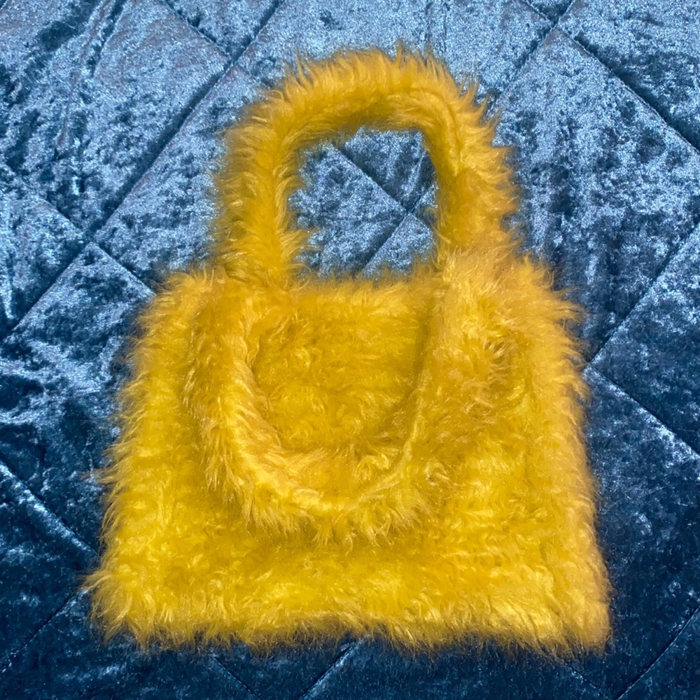 UO lime/yellow fury hand bag